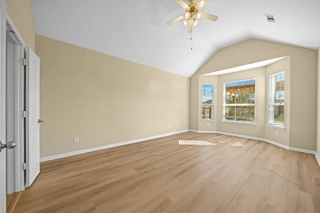 a view of balcony with wooden floor