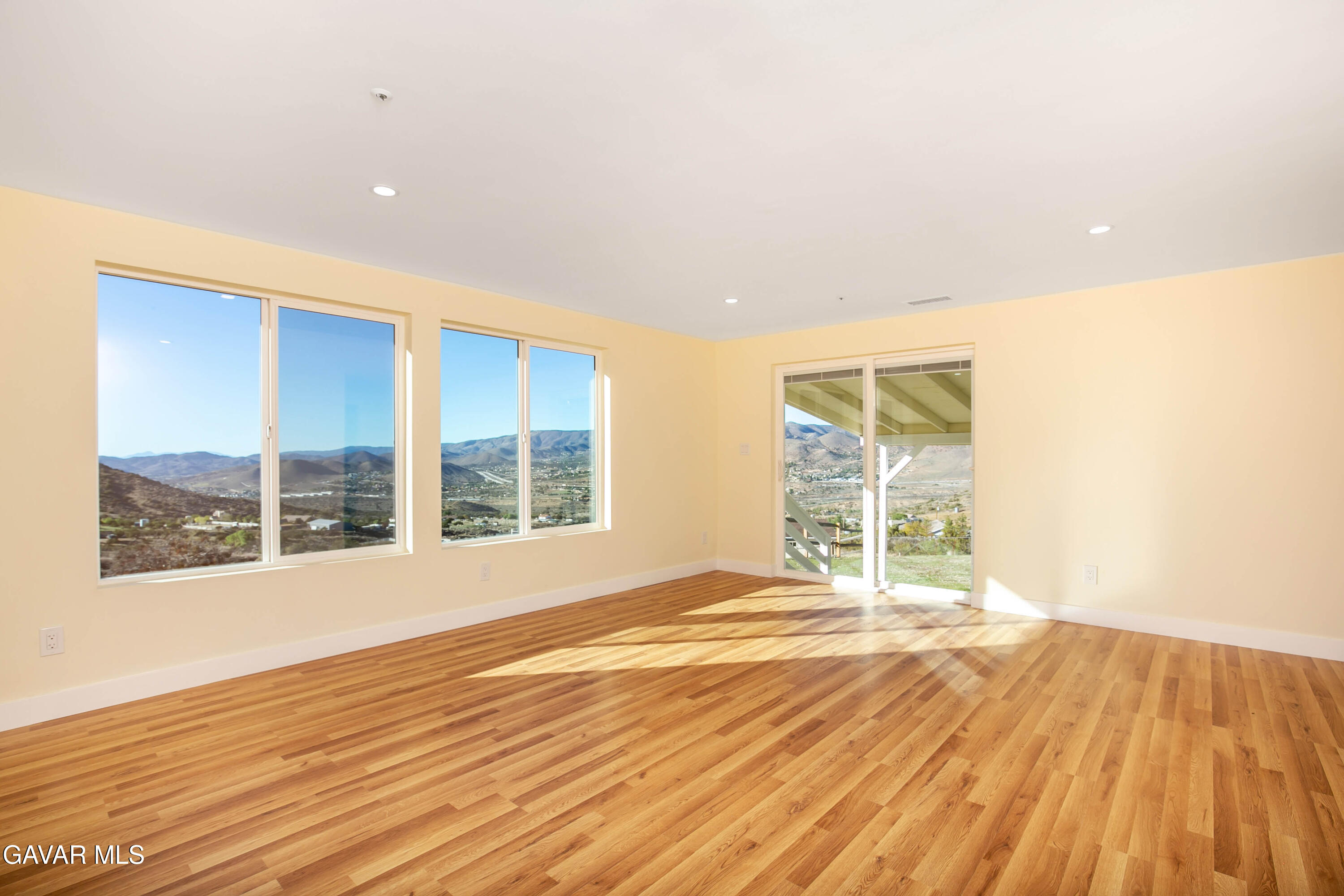 32010 Quirk Road Acton, CA 93550 - Photo 11 of 38 a view of an empty room with wooden floor and a window