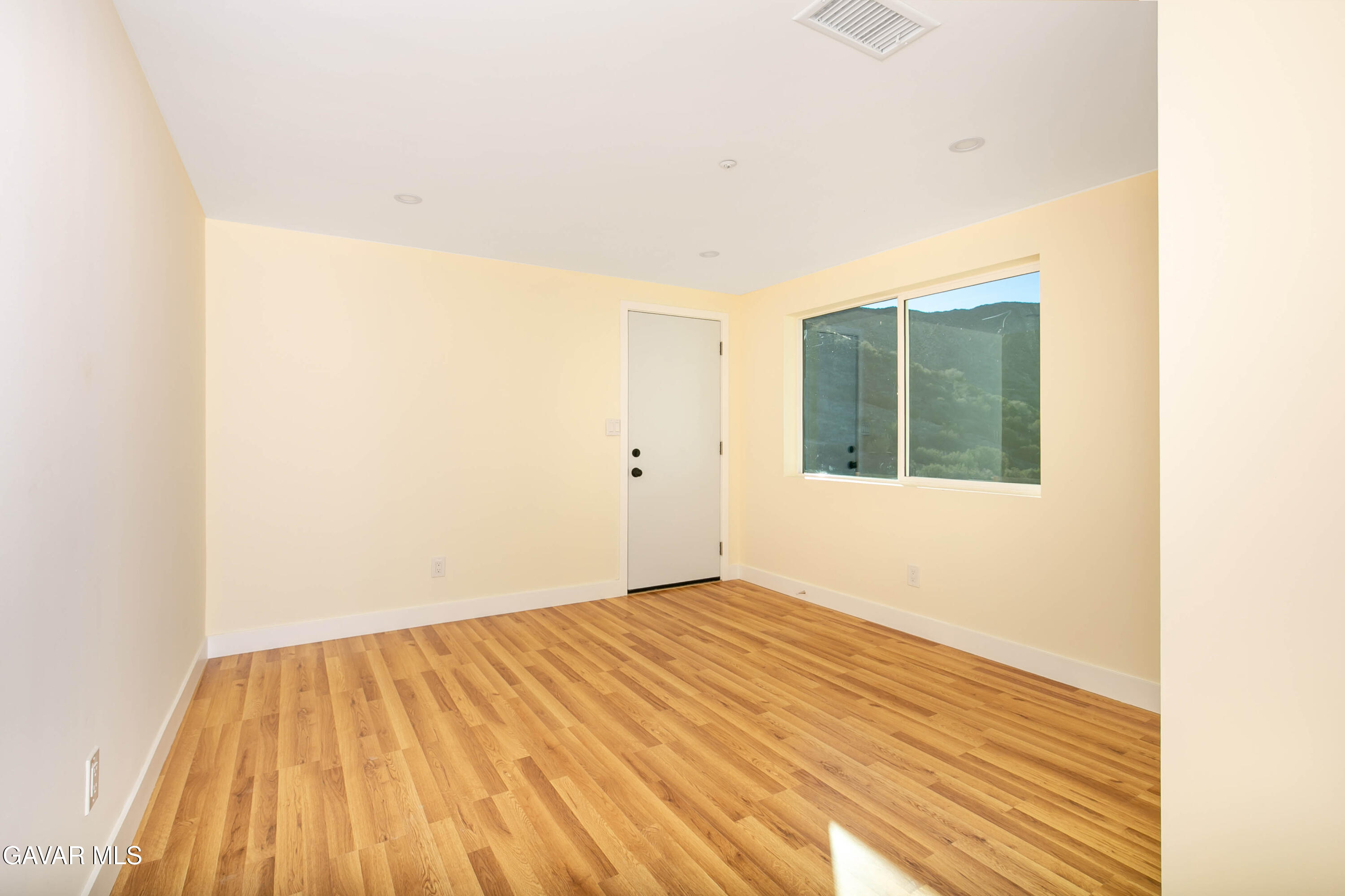 32010 Quirk Road Acton, CA 93550 - Photo 28 of 38 a view of empty room with wooden floor and fan