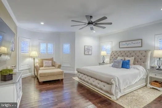 a bedroom with a bed and a television