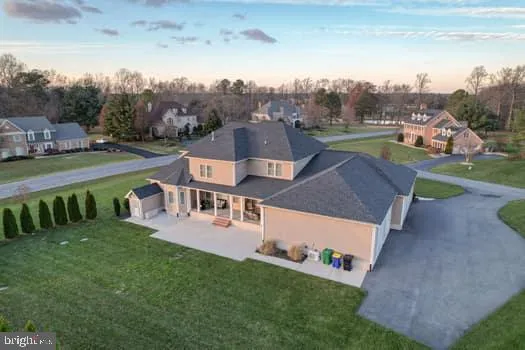 a kitchen with granite countertop white cabinets and stainless steel appliances