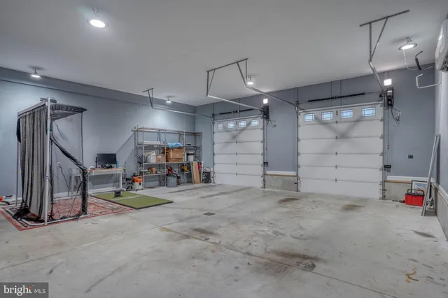 a bedroom with furniture and a projector