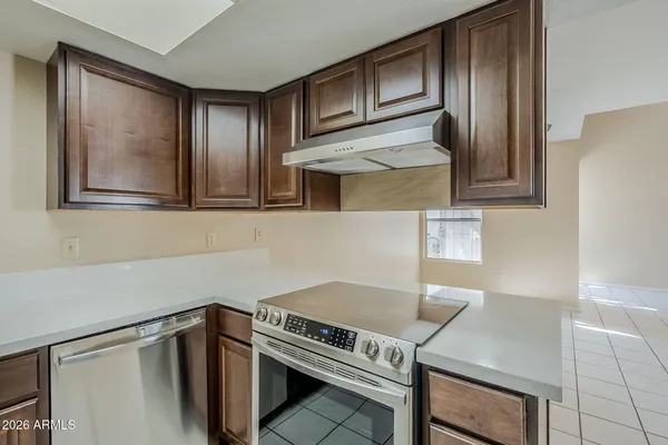 a white refrigerator freezer sitting in a kitchen