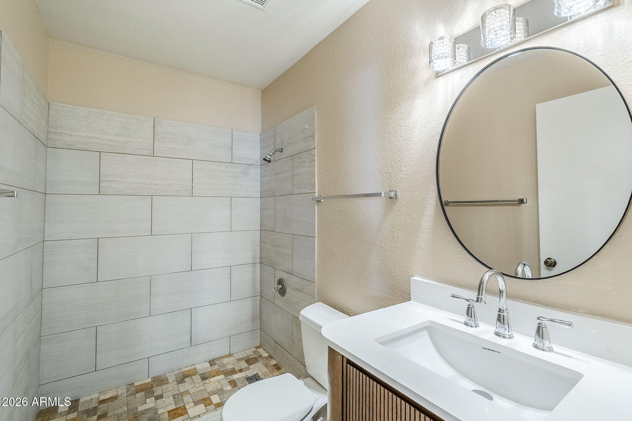 1051 South Dobson Road, Unit 128 Mesa, AZ 85202 - Photo 18 of 30 a bathroom with a sink toilet and a mirror