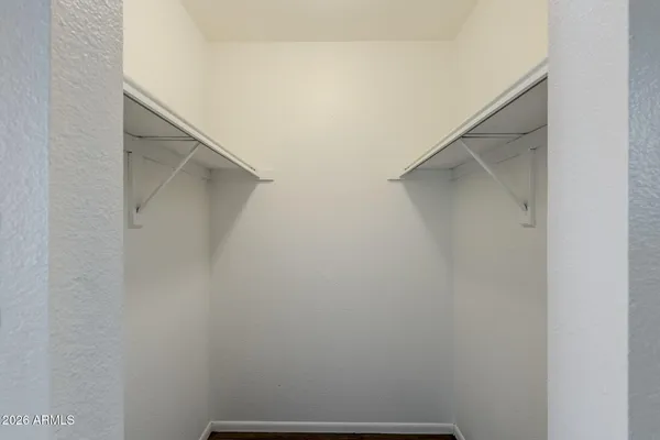 a bathroom with a toilet a sink and a mirror