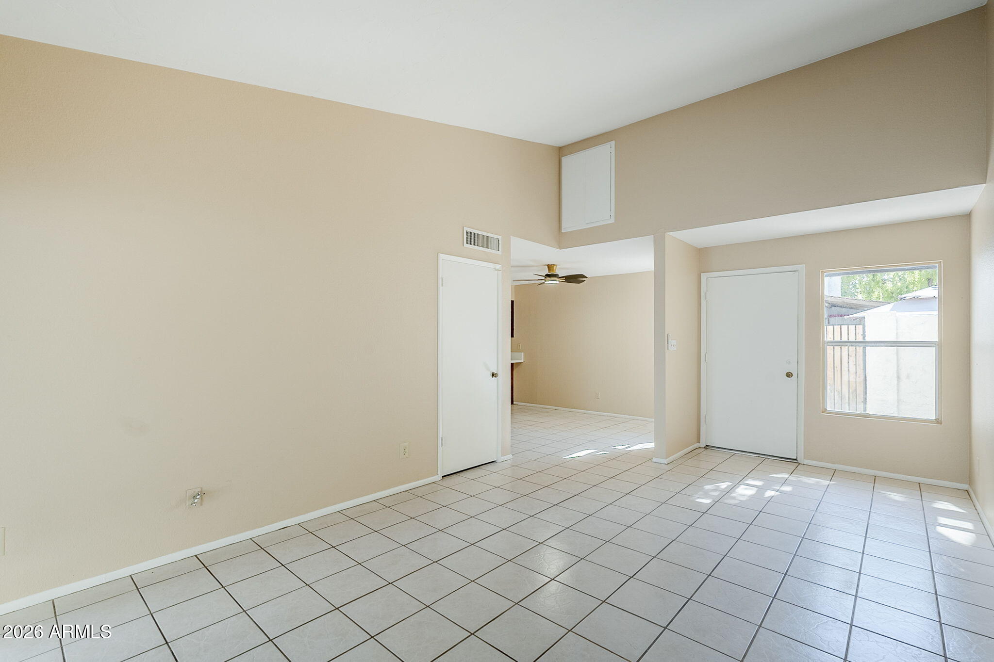 1051 South Dobson Road, Unit 128 Mesa, AZ 85202 - Photo 4 of 30 a view of an empty room and window