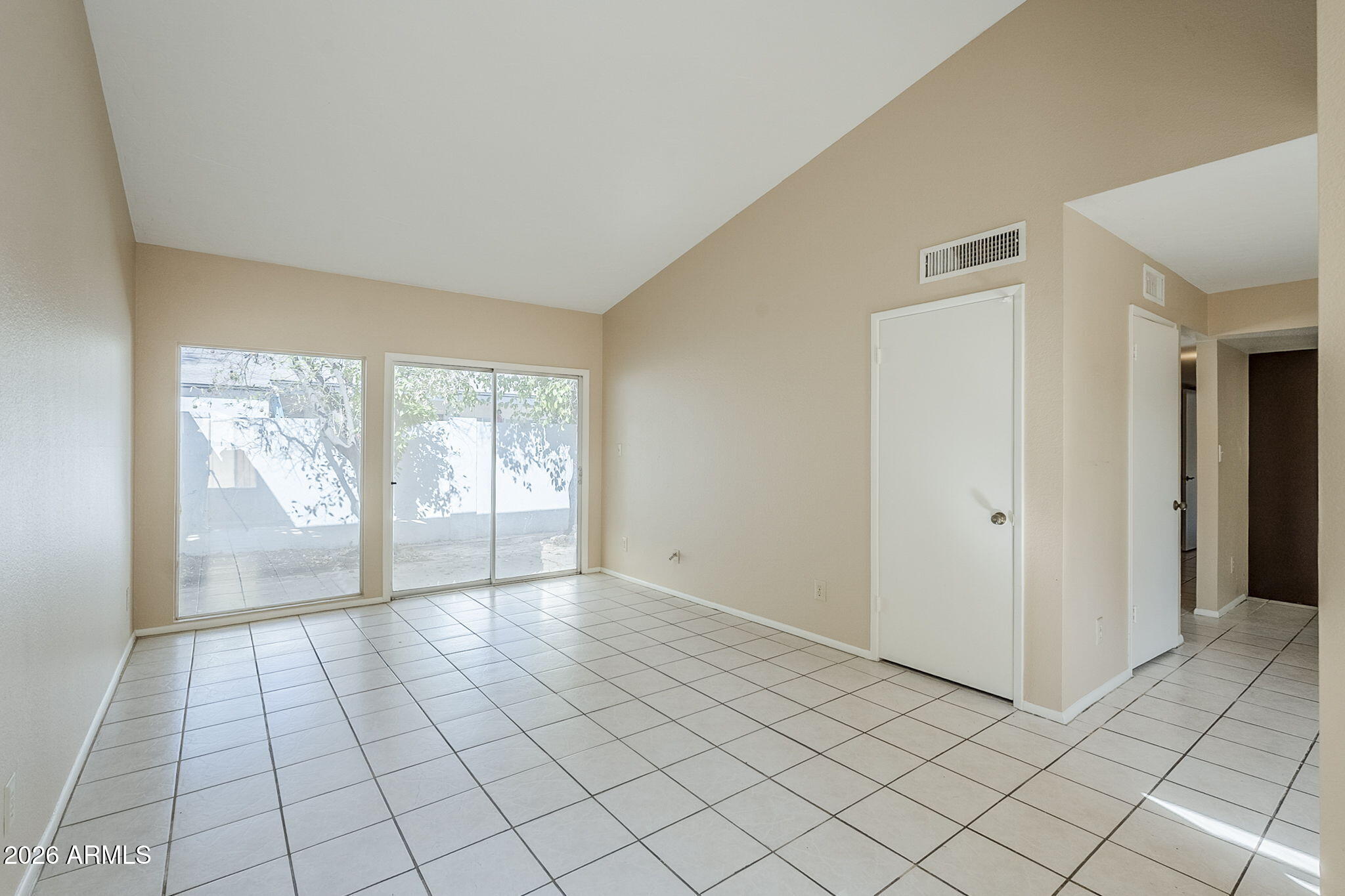 1051 South Dobson Road, Unit 128 Mesa, AZ 85202 - Photo 5 of 30 a view of an empty room and window