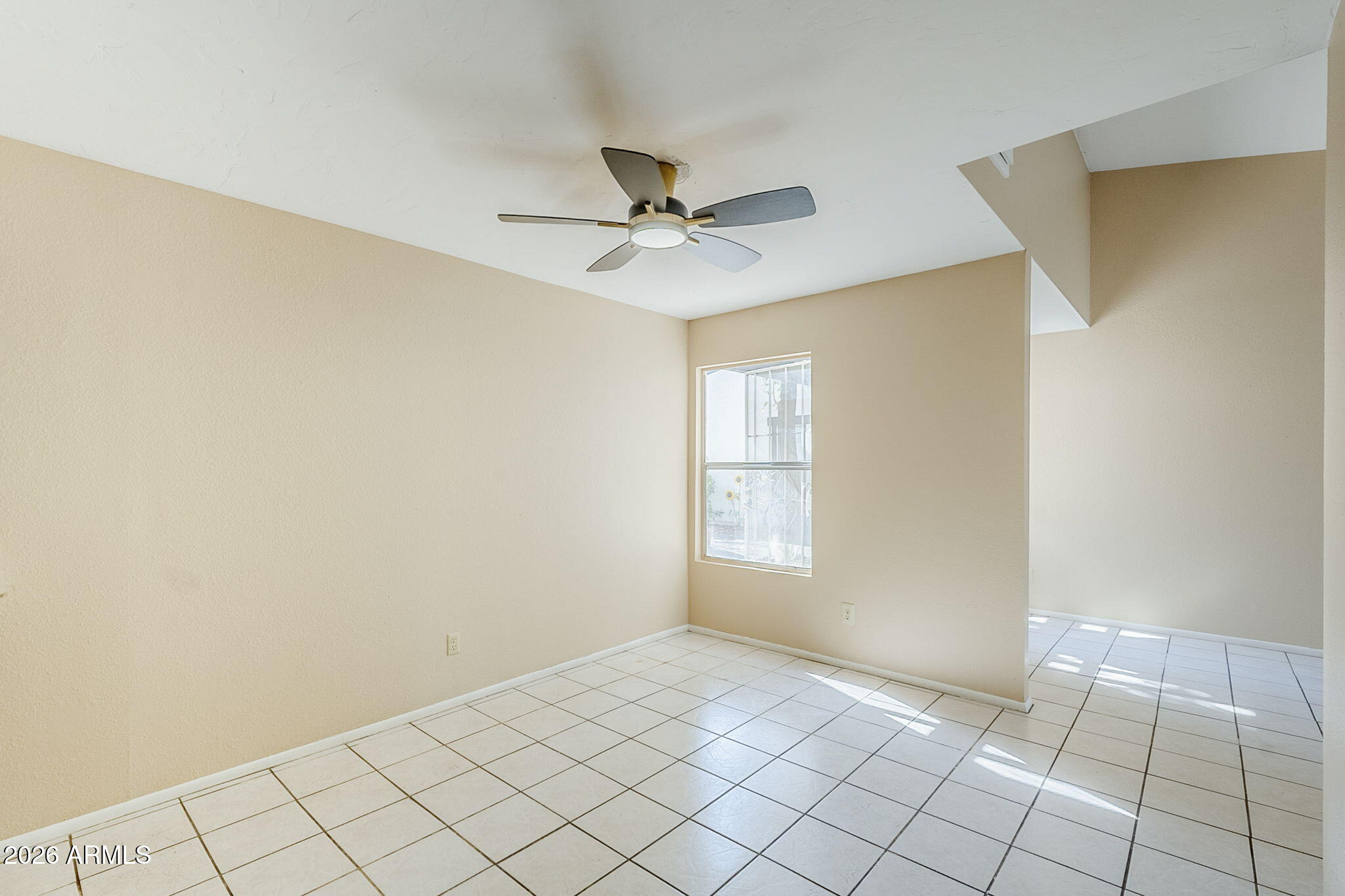 1051 South Dobson Road, Unit 128 Mesa, AZ 85202 - Photo 9 of 30 a view of an empty room with a window