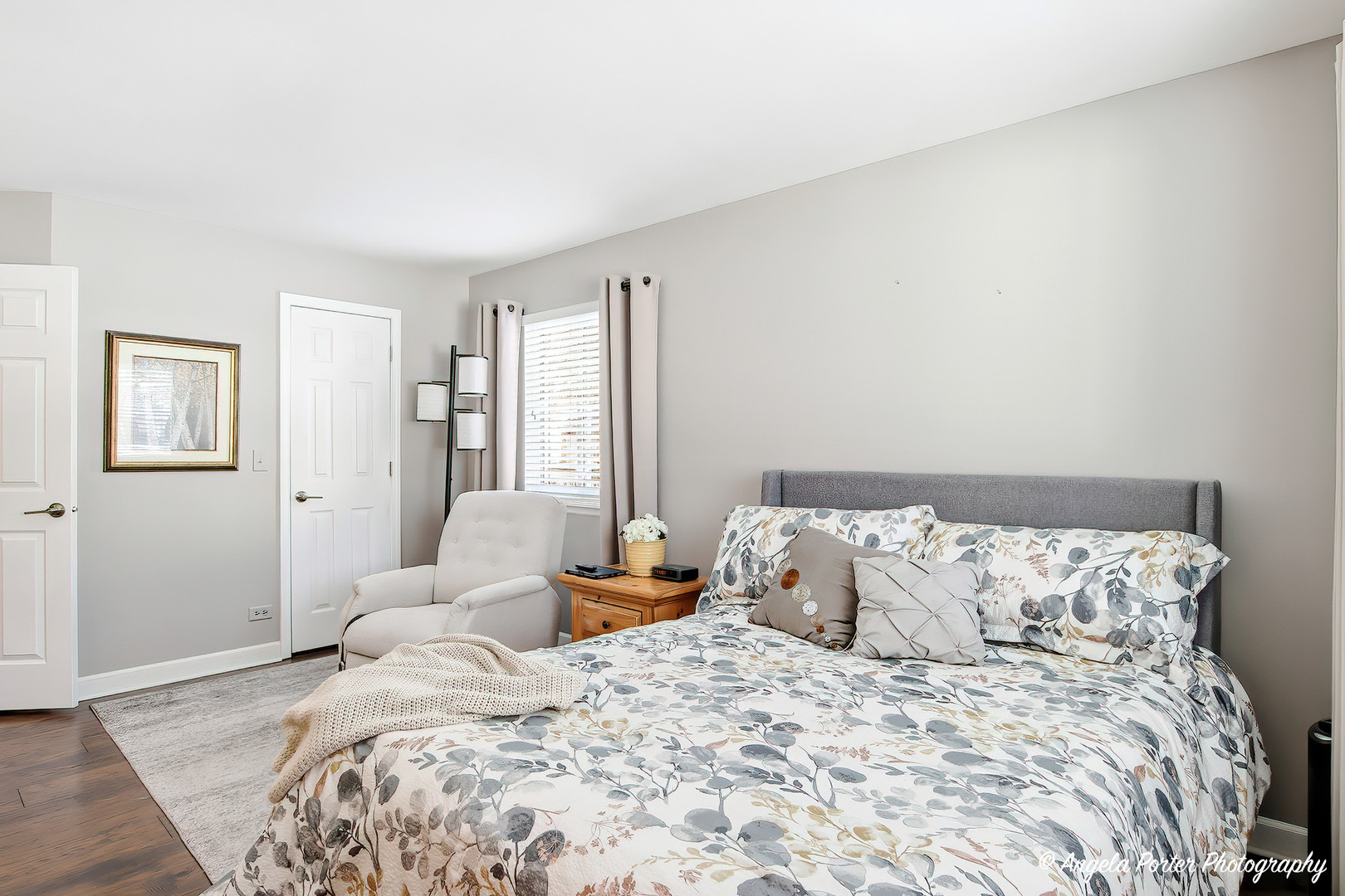 1516 Camden Court, Unit A1 Wheeling, IL 60090 - Photo 13 of 25 a bed sitting in a bedroom next to a window with a large bed
