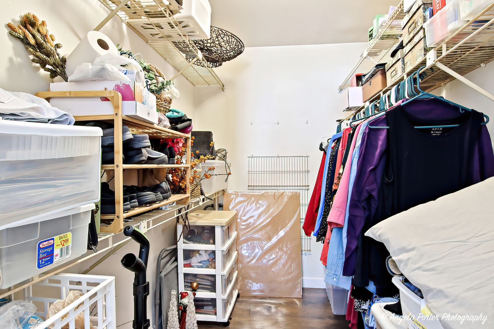 1516 Camden Court, Unit A1 Wheeling, IL 60090 - Photo 14 of 25 a view of walk in closet with clothes and shoes