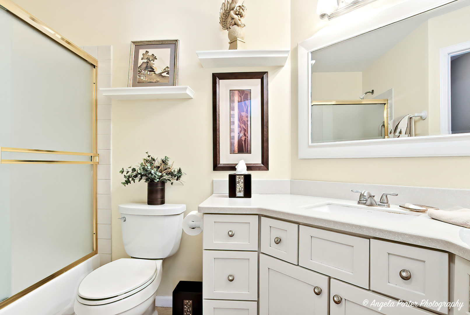 1516 Camden Court, Unit A1 Wheeling, IL 60090 - Photo 16 of 25 a bathroom with a toilet sink and mirror