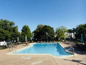 1516 Camden Court, Unit A1 Wheeling, IL 60090 - Photo 21 of 25 a view of a swimming pool with an outdoor seating