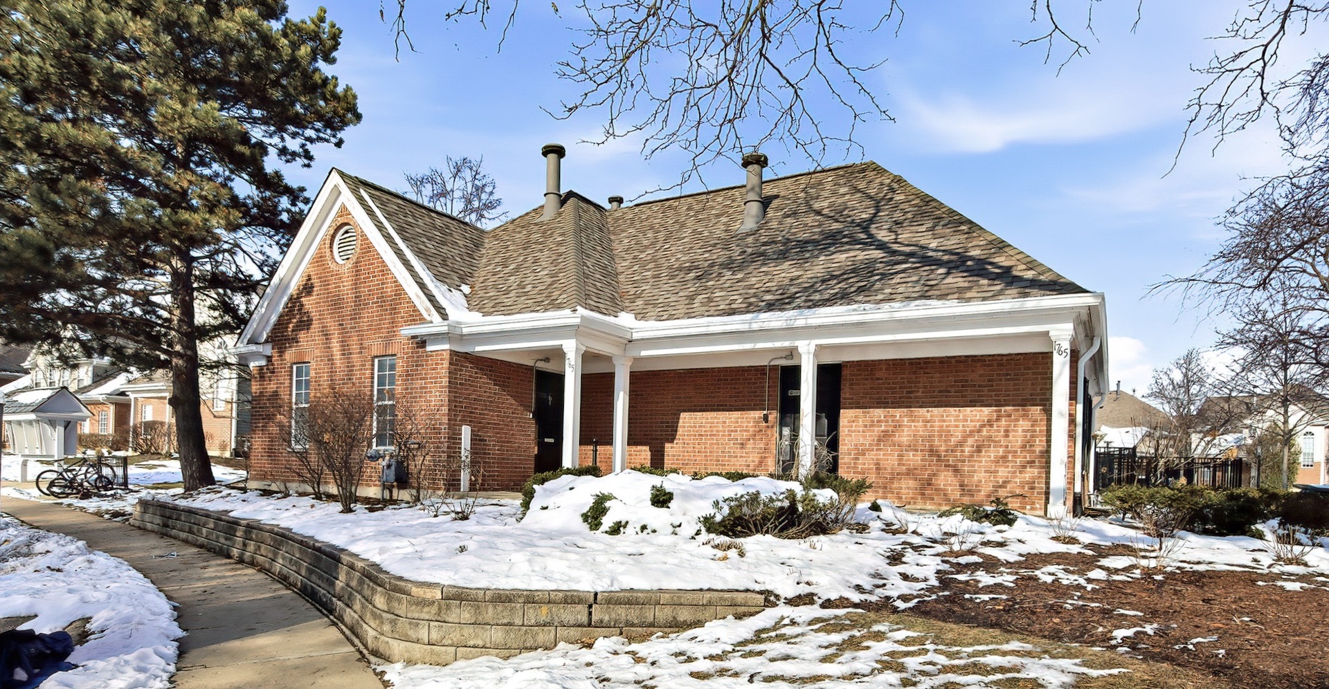 1516 Camden Court, Unit A1 Wheeling, IL 60090 - Photo 25 of 25 a view of a house with a snow in the yard