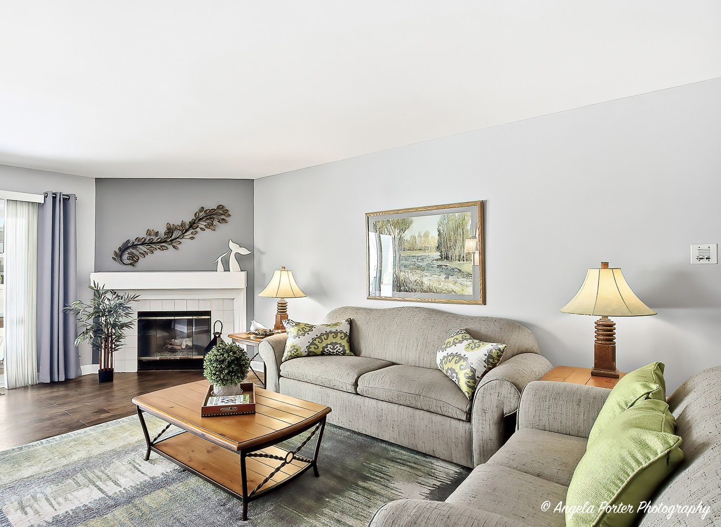 1516 Camden Court, Unit A1 Wheeling, IL 60090 - Photo 4 of 25 a living room with furniture and a fireplace