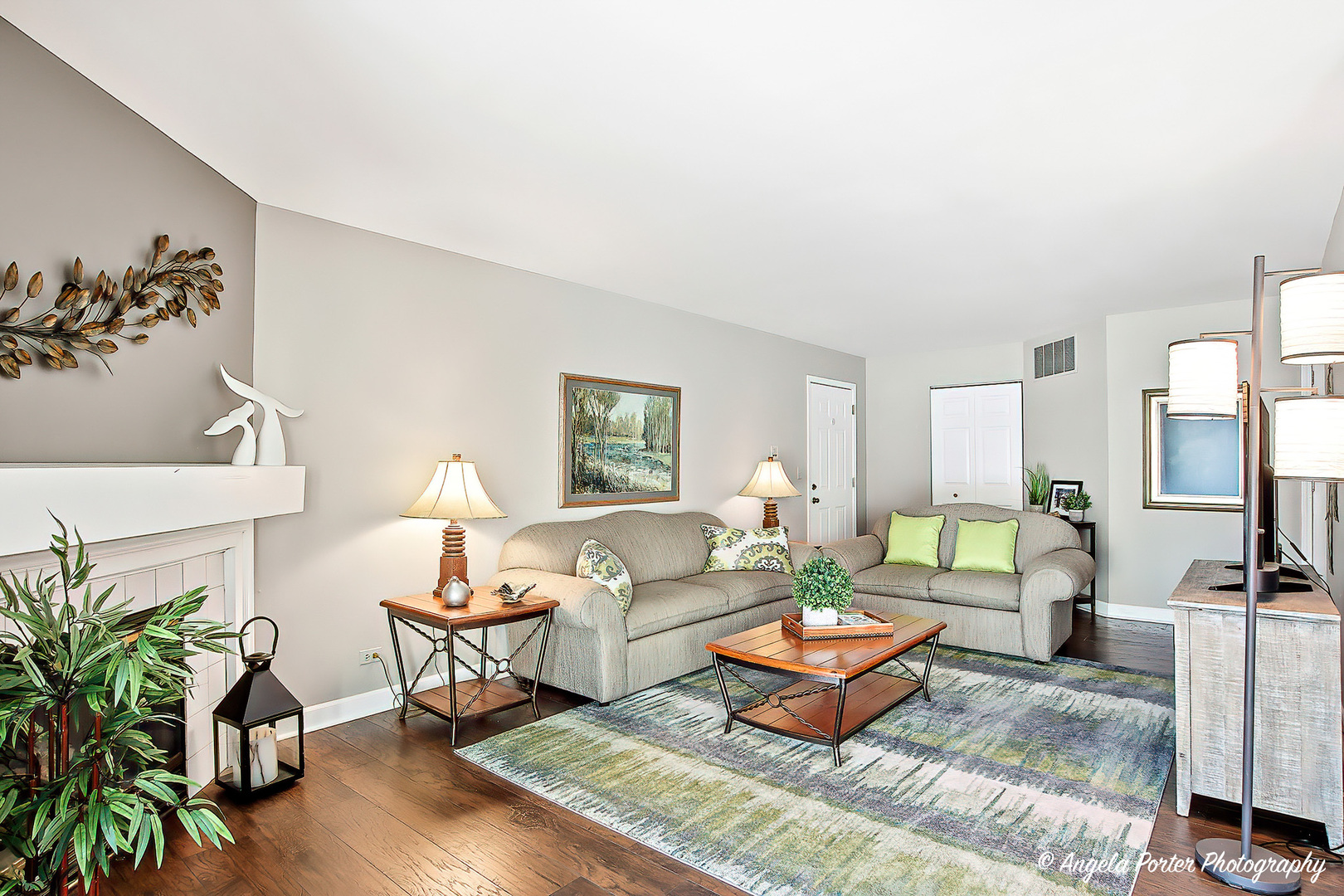 1516 Camden Court, Unit A1 Wheeling, IL 60090 - Photo 5 of 25 a living room with furniture or couch and a potted plant