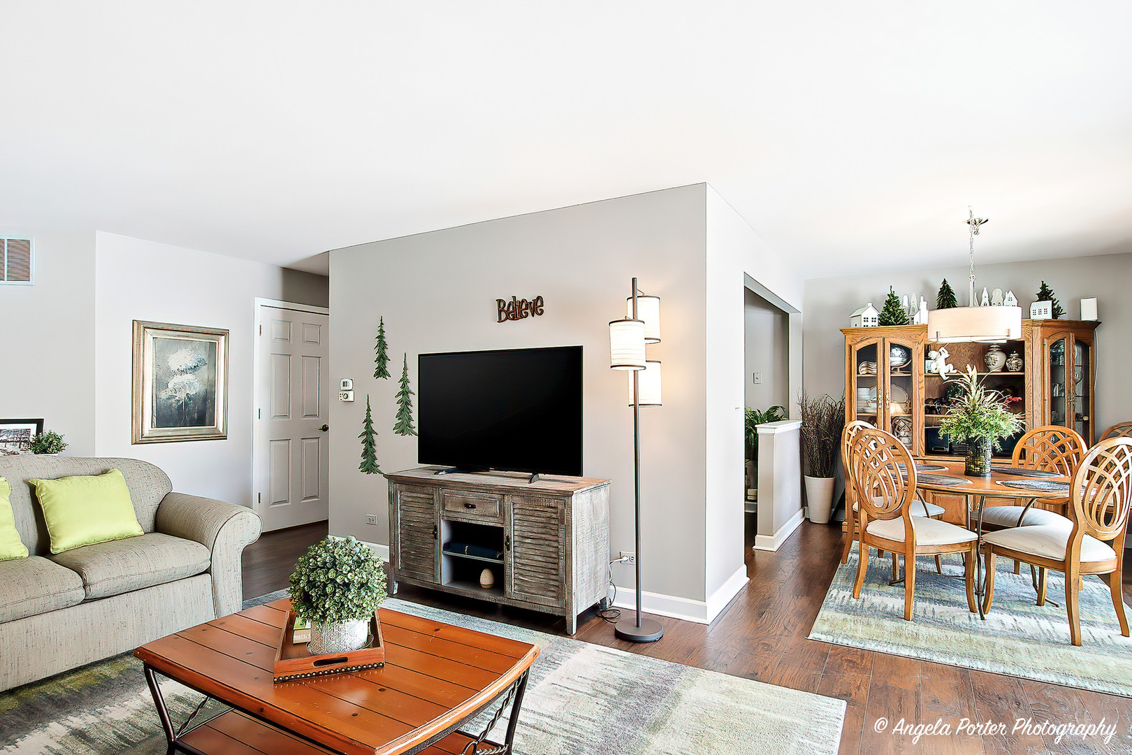 1516 Camden Court, Unit A1 Wheeling, IL 60090 - Photo 6 of 25 a living room with furniture and a flat screen tv