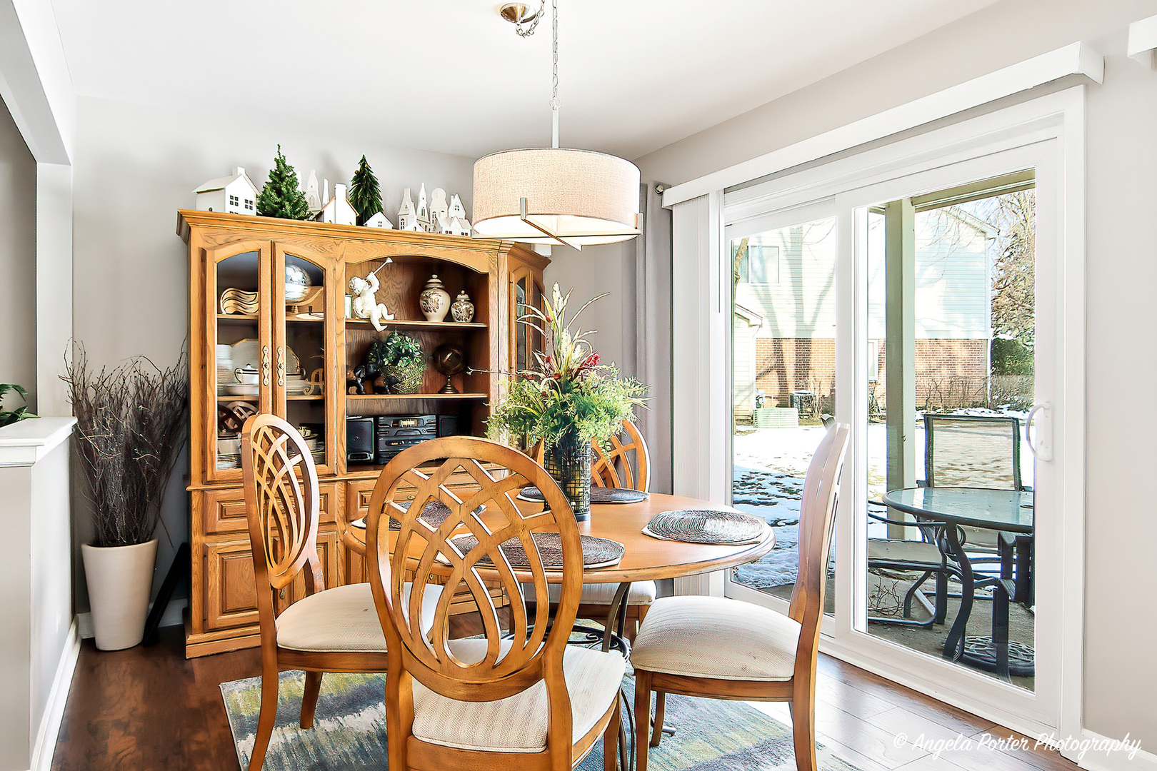 1516 Camden Court, Unit A1 Wheeling, IL 60090 - Photo 7 of 25 a dining room with furniture window and wooden floor