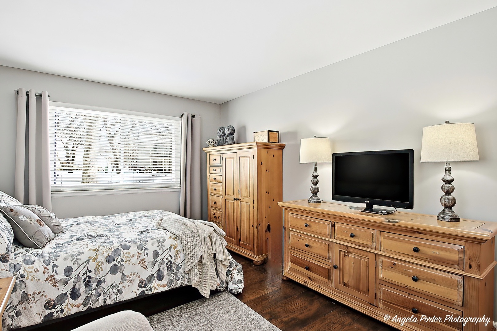 1516 Camden Court, Unit A1 Wheeling, IL 60090 - Photo 10 of 25 a bedroom with a bed and flat screen tv