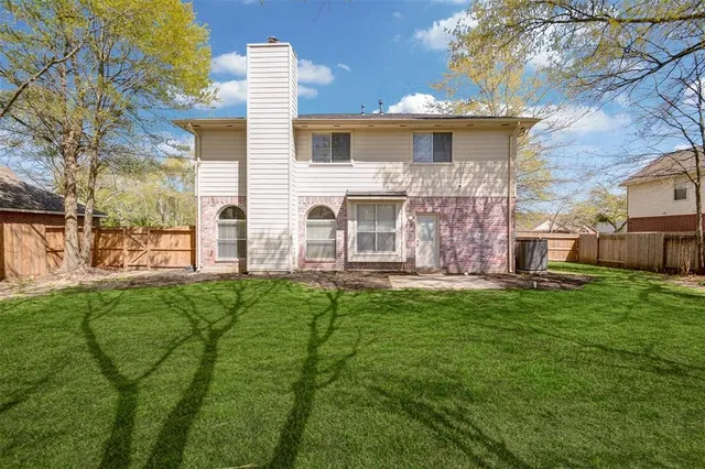 a view of a yard with a tree