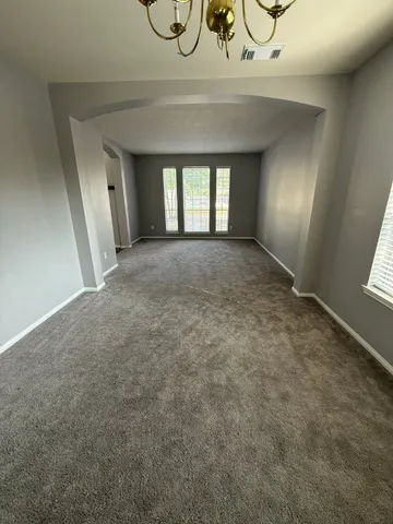 a view of an empty room and window