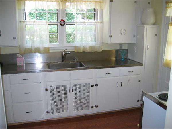 167 Springfield Street Springfield, MA 01107 - Photo 8 of 23 a kitchen with granite countertop white cabinets and a sink