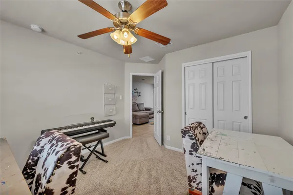 a bedroom with furniture and a chandelier
