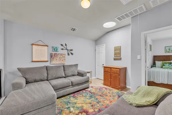 a living room with furniture and a couch