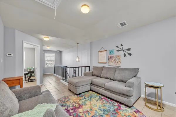 a living room with furniture and a couch
