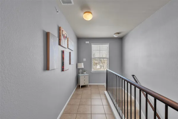 a view of a hallway with windows