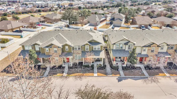 an aerial view of residential houses and outdoor space