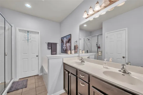 a bedroom with a bed and cabinets