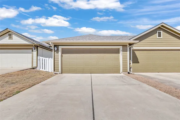 a view of garage and yard