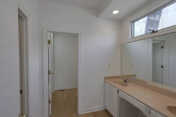 a bathroom with a glass shower door