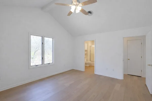 a view of a chandelier fan and entryway