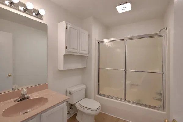 a view of an empty room with glass door