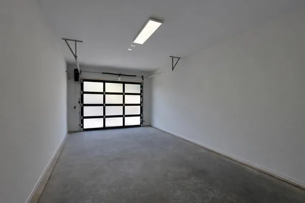 a view of a back yard of the house with a patio