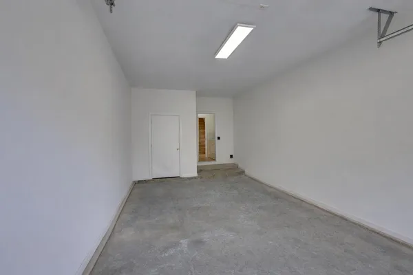 a view of balcony with wooden floor and fence