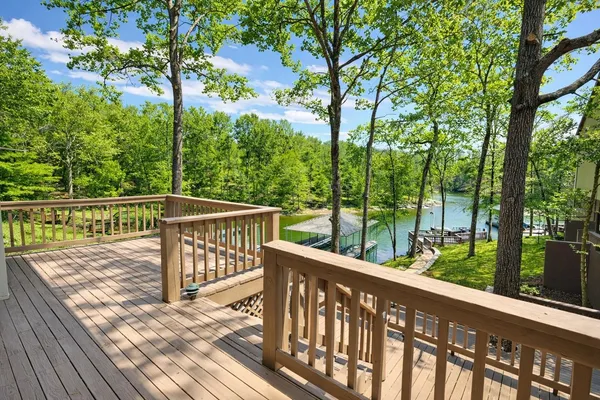 a view of a roof deck with couches and wooden floor