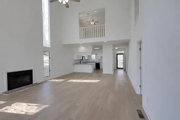 a kitchen with kitchen island a sink stove and refrigerator