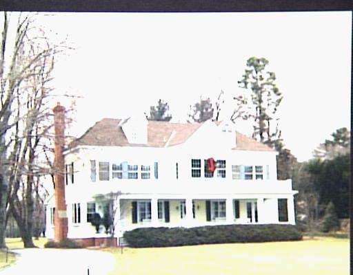 55 Beachside Avenue Westport, CT 06880 - Photo 1 of 1 a front view of residential houses with yard