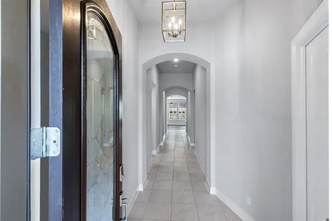 a view of a hallway with front door