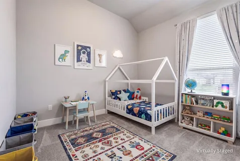 a room with lots of furniture and a rug