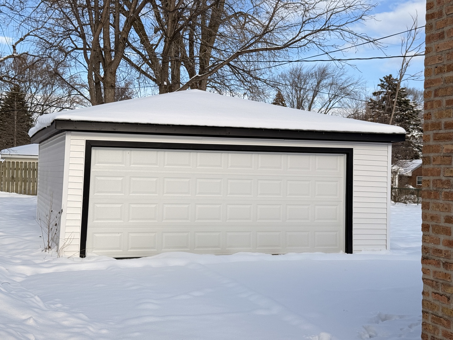 118 Windsor Lane Glendale Heights, IL 60139 - Photo 19 of 23 a side of a house that has a tree in front of it