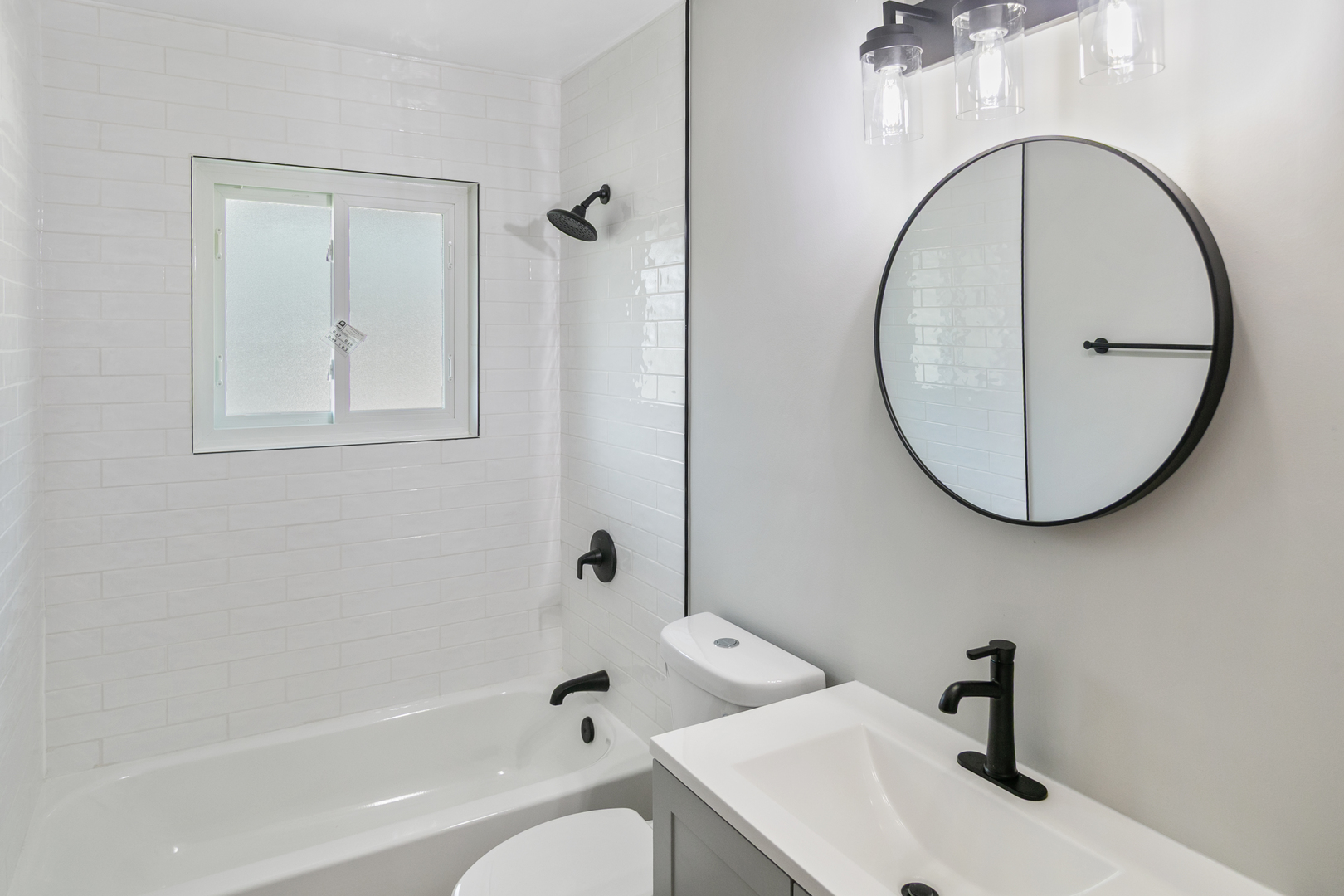 118 Windsor Lane Glendale Heights, IL 60139 - Photo 7 of 23 a bathroom with a sink a toilet and a mirror