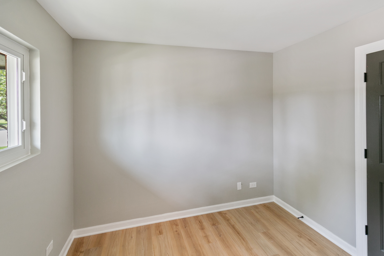 118 Windsor Lane Glendale Heights, IL 60139 - Photo 9 of 23 a view of a small space with wooden floor and a window