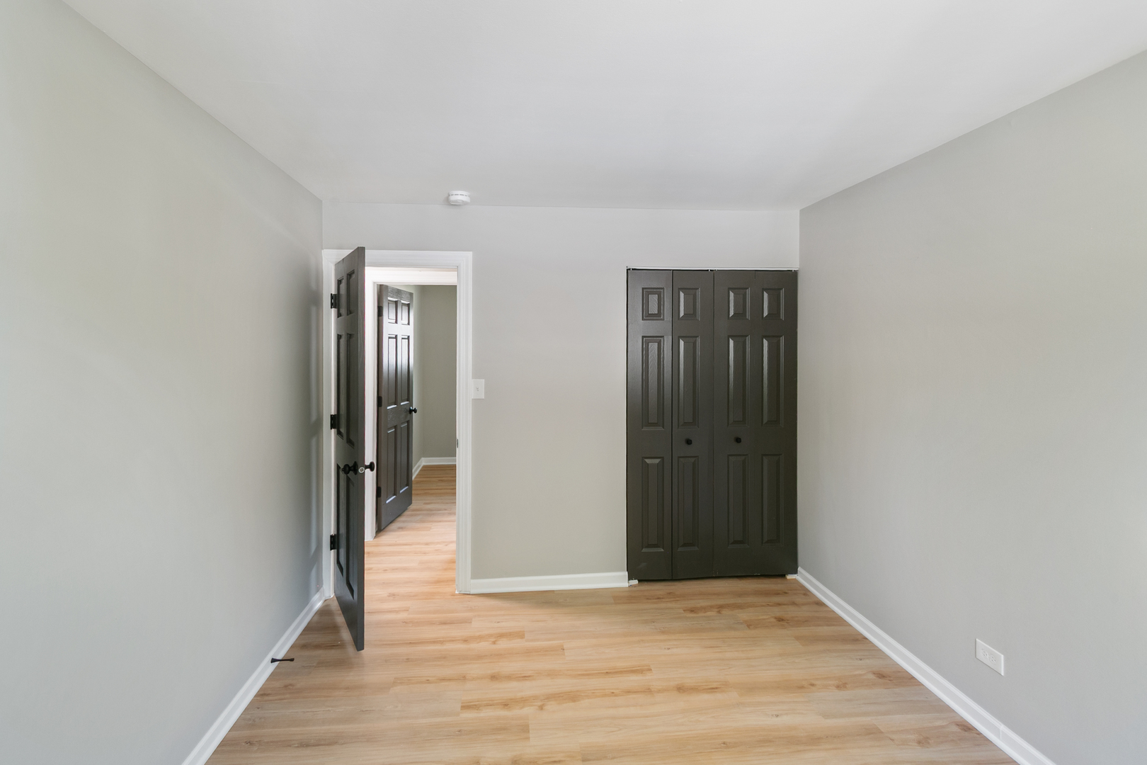 118 Windsor Lane Glendale Heights, IL 60139 - Photo 10 of 23 a view of an empty room with wooden floor