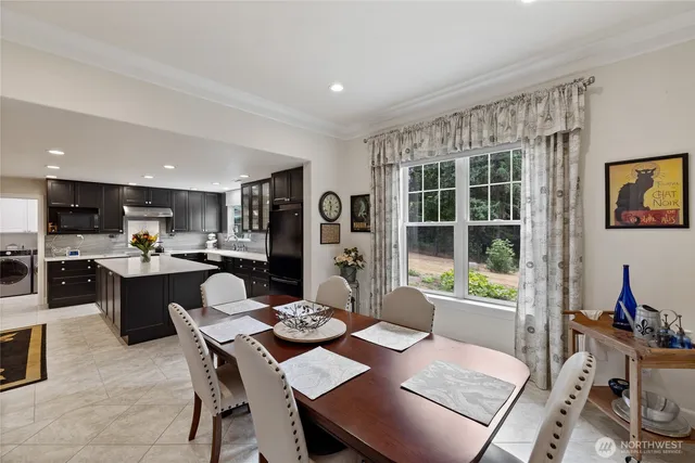 a view of a dining room with furniture window and outside view