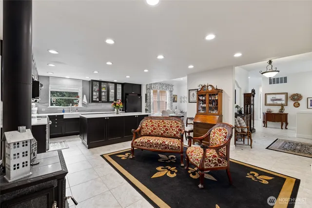 a living room with furniture and kitchen view