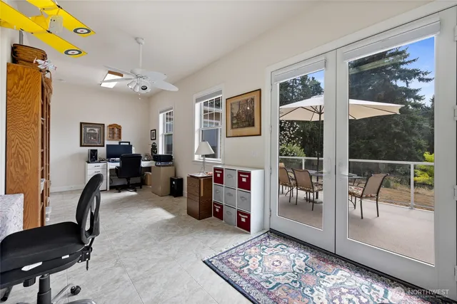 a view of a livingroom with furniture and windows