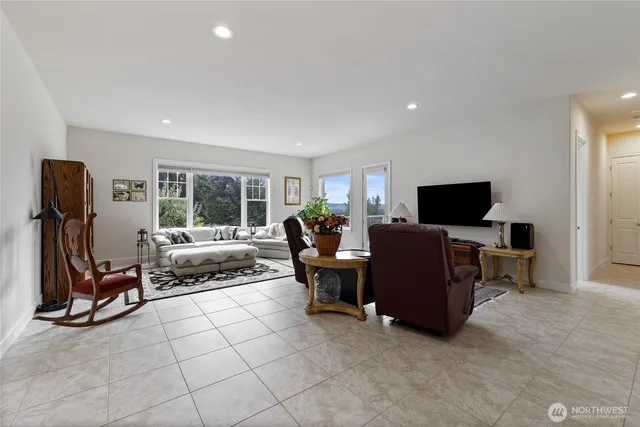a view of a livingroom with furniture and a flat screen tv
